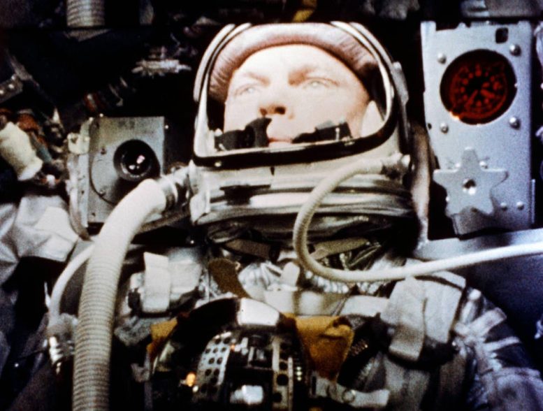 Astronaut John Glenn Squeezes Inside Friendship 7 Capsule